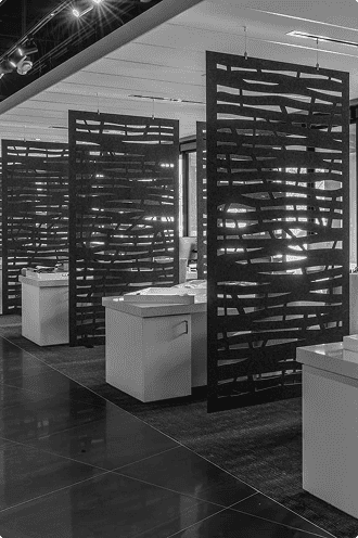 Sleek modern office partitions with black geometric designs for workspace privacy and style.