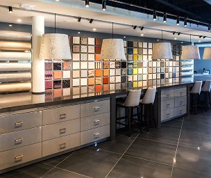 High-quality interior design showroom with colorful sample displays and modern cabinetry.